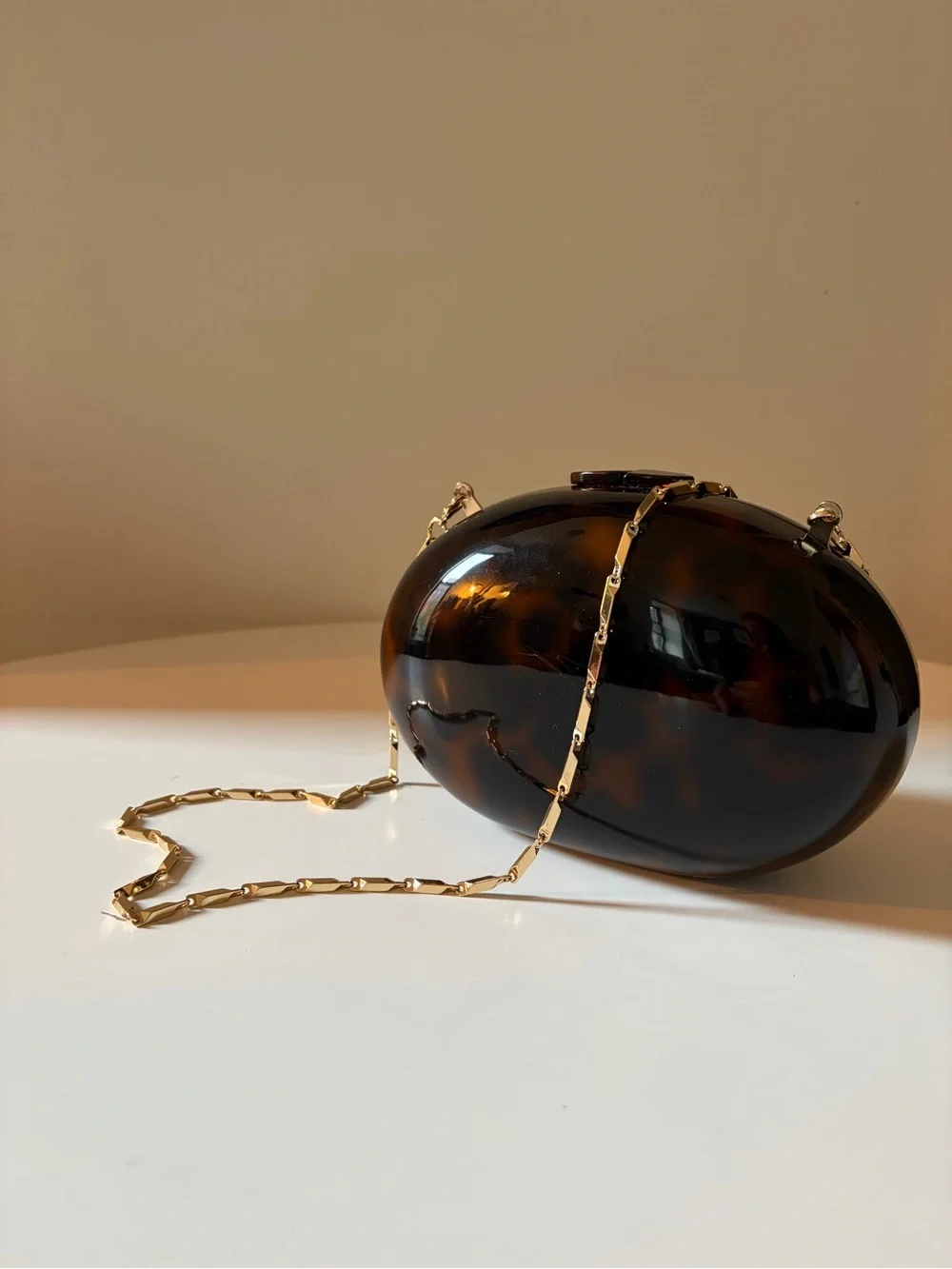 Mango Tortoiseshell Oval Clutch with Gold Chain Strap